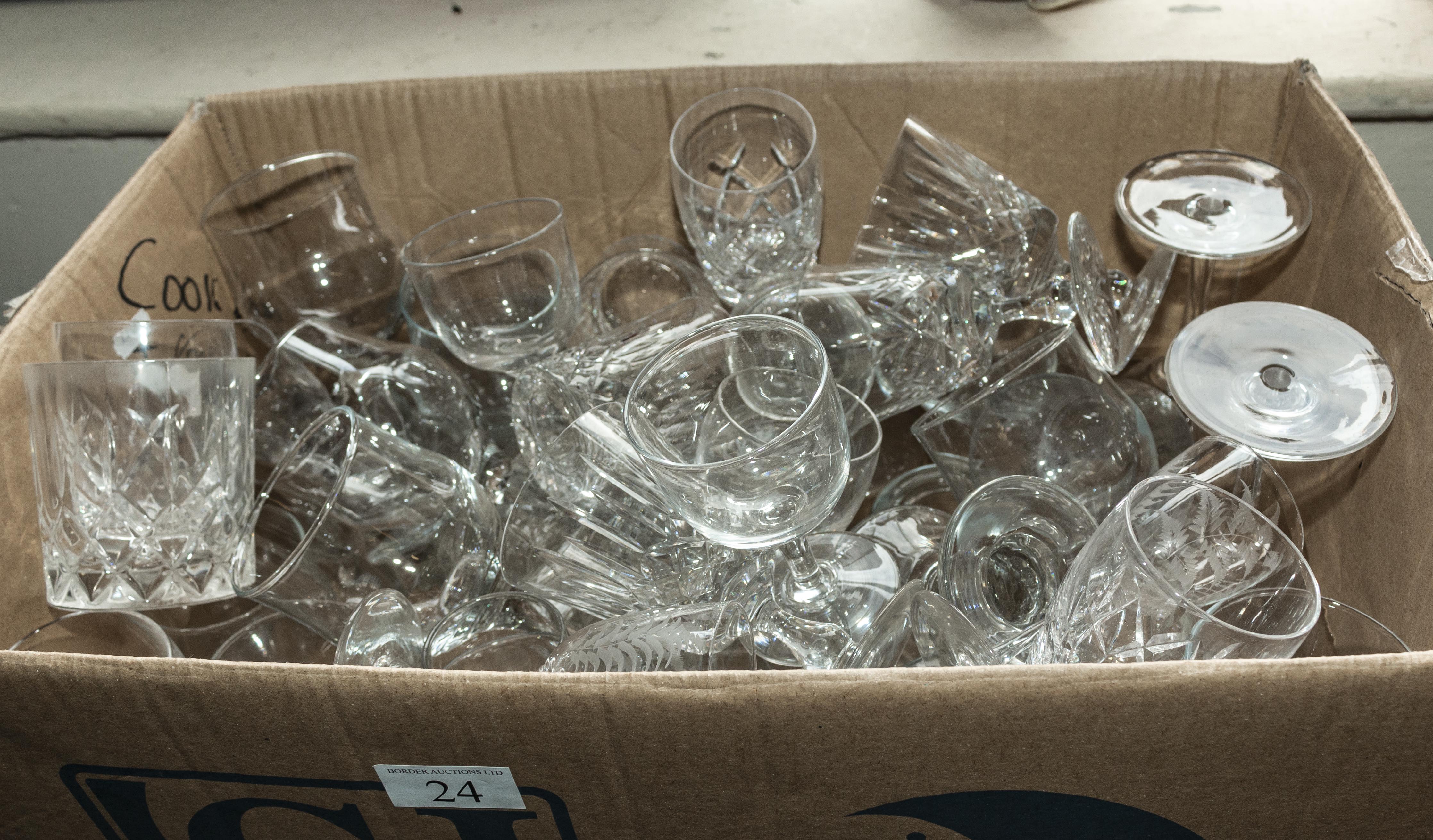 A box containing assorted glasses
