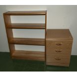 An open bookshelf and a small bedside chest