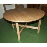 A circular pine Ikea dining table