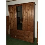 A three door pine wardrobe