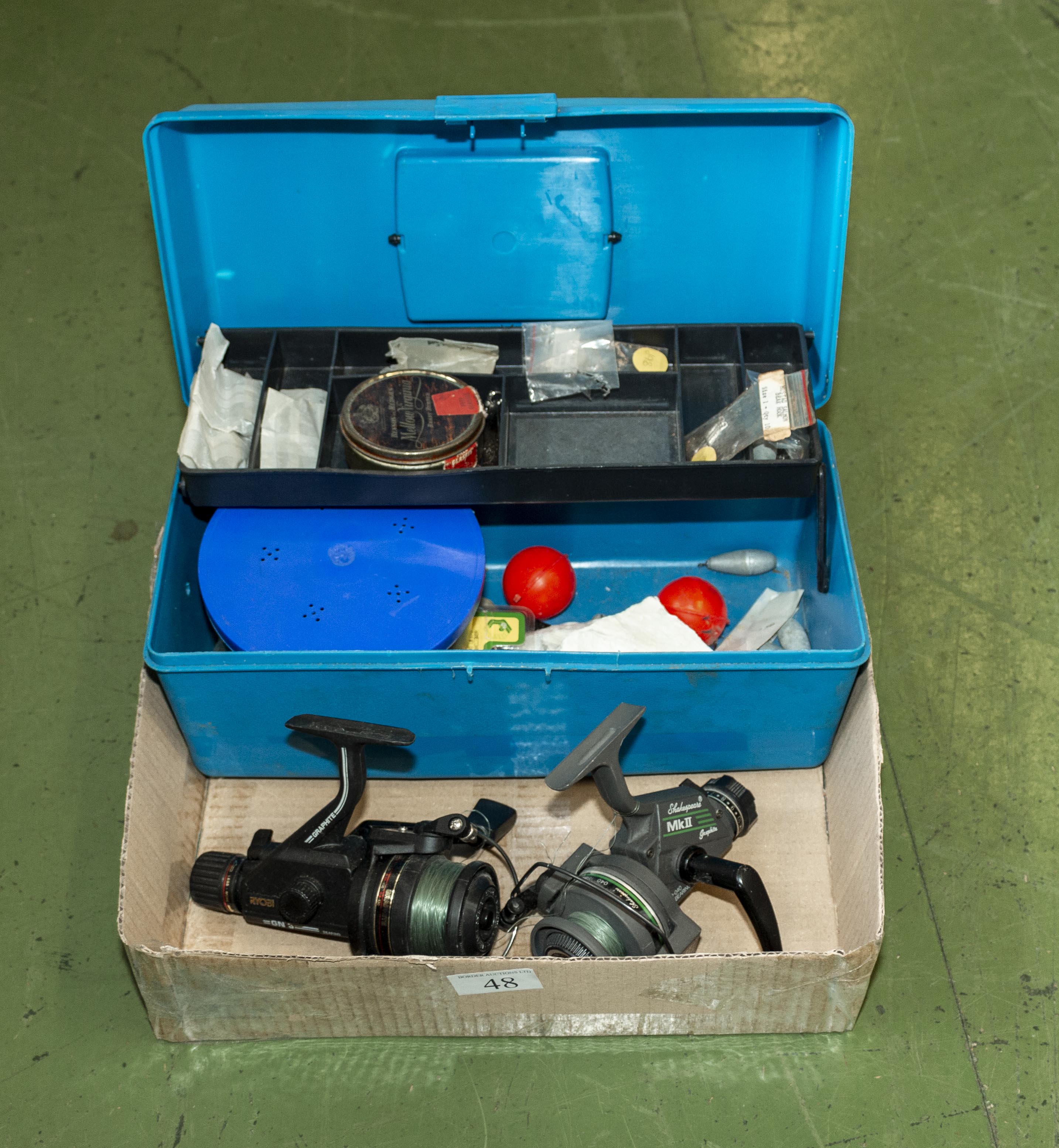 A box of fishing tackle and two spinning reels