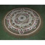 A circular cream ground wool rug