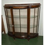 A bow fronted display cabinet