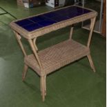 A tiled top basket weave garden table