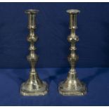 A pair of brass candle sticks