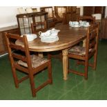 A pine extending table and four chairs