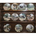 Eleven Royal Doulton decorative plates