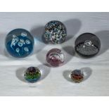 Six glass paperweights