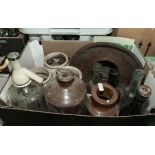 A box containing a collection of vintage glass and stoneware bottles