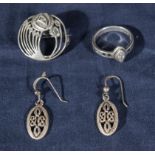 A silver brooch, ring and earrings