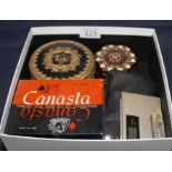 A box containing Canasta cards and other collectable items