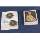 Two Royal Army Service Corps cap badges and cigarette cards for Africa's war effort