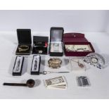 A collection of wrist watches, pens, lighters and other items