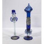 A glass candle stick and a blue glass pulpit vase