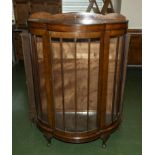 A bow fronted display cabinet