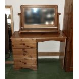 A pine dressing table and mirror