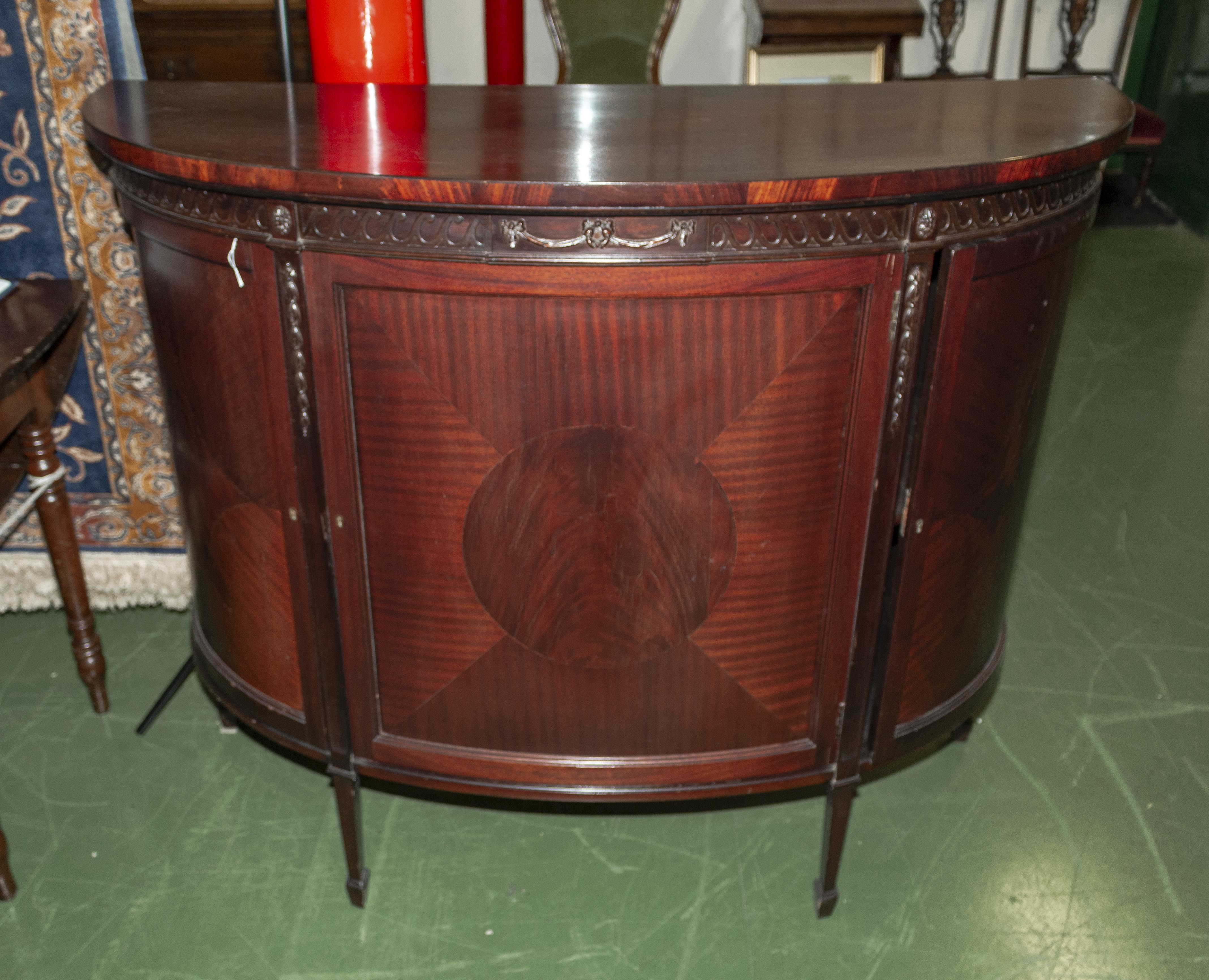 A bow front side cabinet.