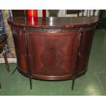 A bow front side cabinet.
