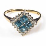 A lady's 9ct gold ring set with blue topaz and diamonds, size P