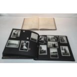 A photograph album together with a hand written book of mathematics