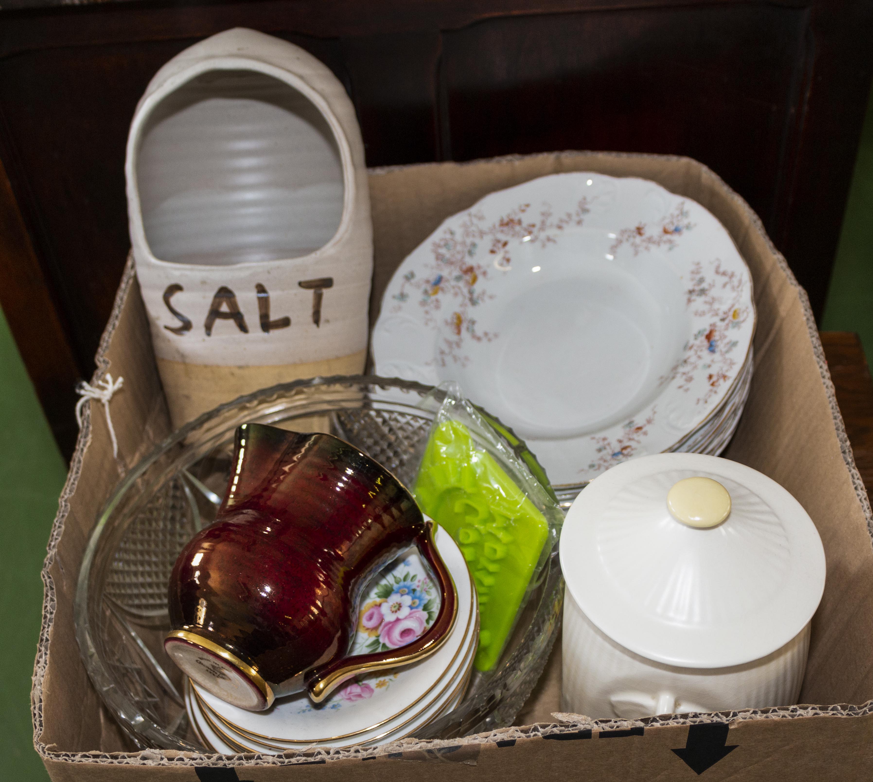 A box containing pottery and glass