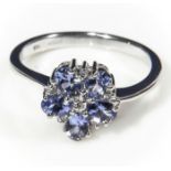 A lady's 9ct white gold ring set with 5 tanzanite and diamonds, size P