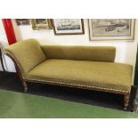 A late Victorian oak framed chaise longue