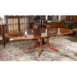 A high quality mahogany dining table with satin wood cross banding.