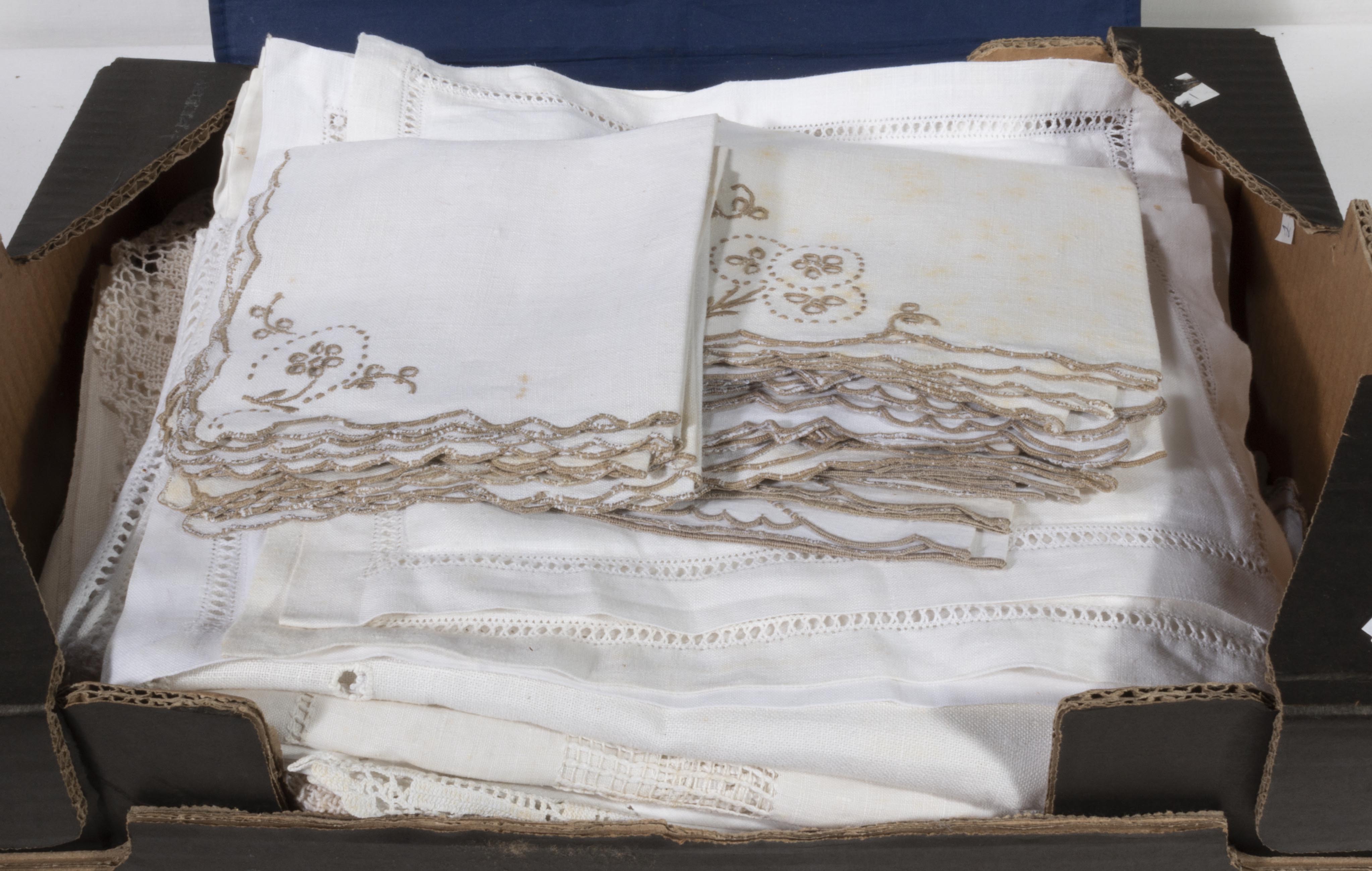 A box of vintage table linen
