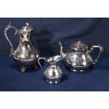 A silver plated teapot and cream jug with a silver plated water jug