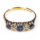 A lady's 18ct gold three sapphire and diamond ring, size P