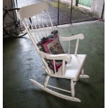 A white painted rocking chair