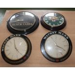 Four advertising wall clocks