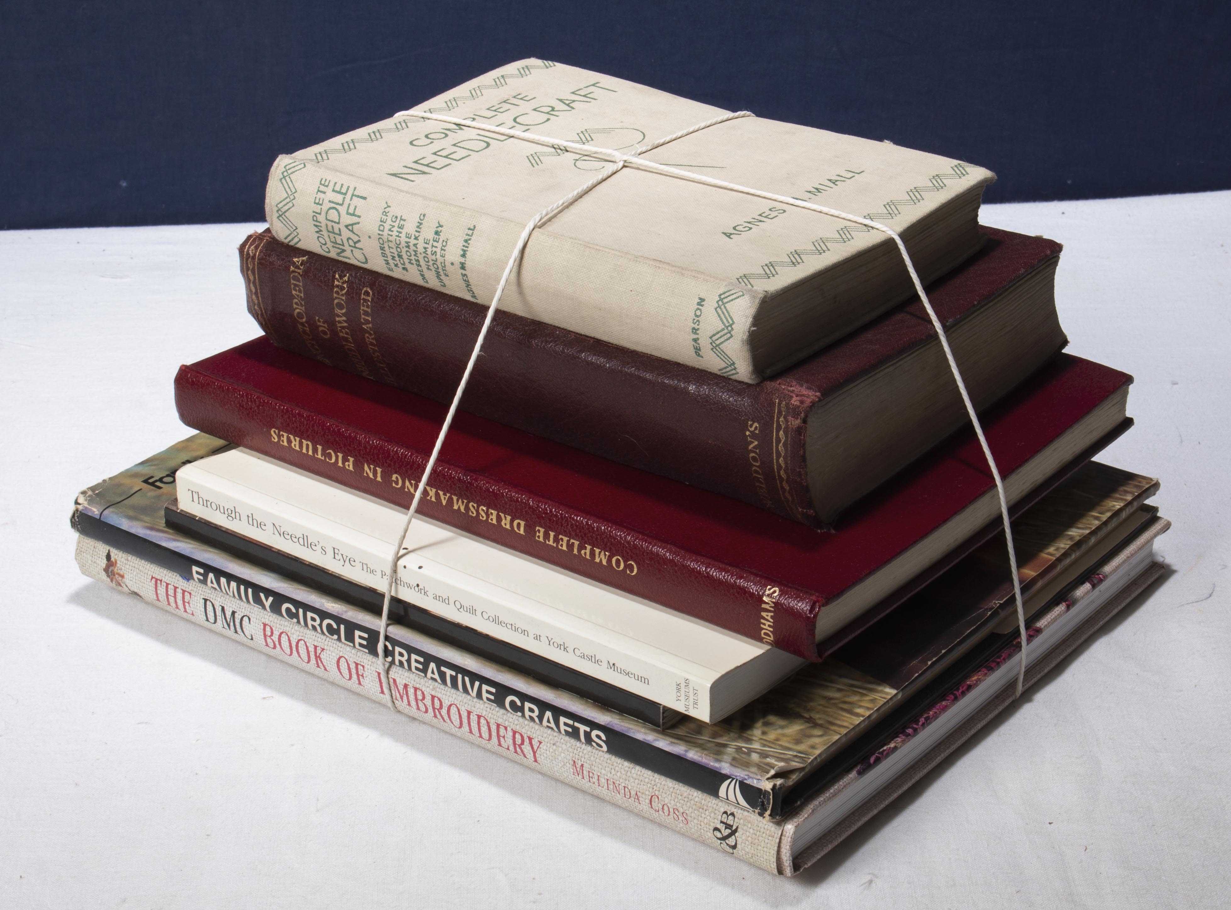 A bundle of books relating to needlecraft