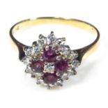 An 18ct yellow and white gold ruby and diamond cluster ring, size N