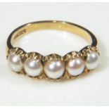 A lady's 9ct gold ring set with 5 pearls, size Q