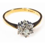 An 18ct yellow and white gold 7 stone diamond cluster ring 50 point, size S