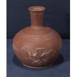 An Oriental terracotta vase decorated with dragons, 22cm tall