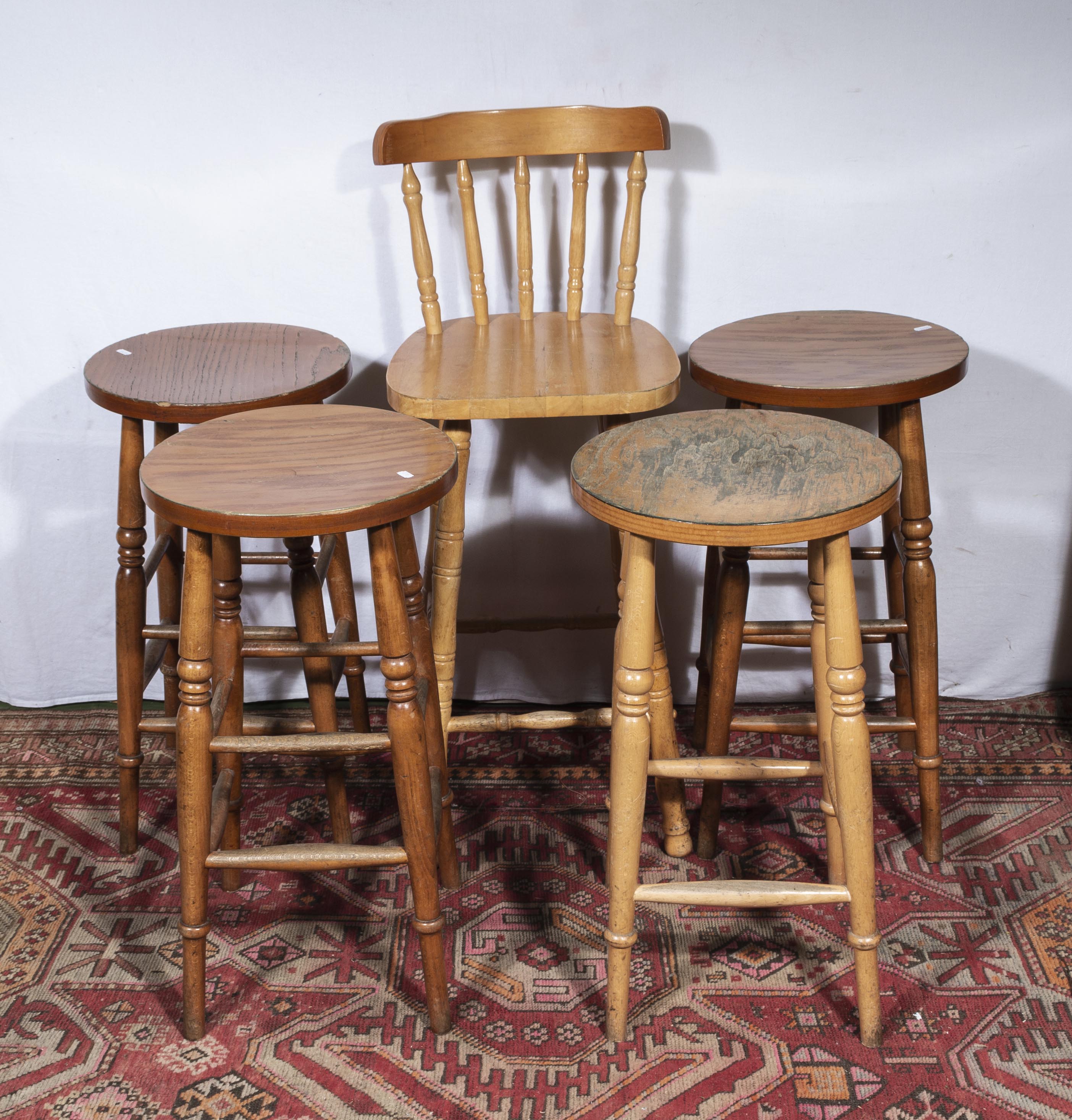 Four pine bar stools and a bar chair