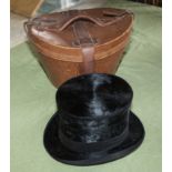 A top hat in a leather case 'The Brummell' makers name R W Forsyth, Princess Street, Edinburgh