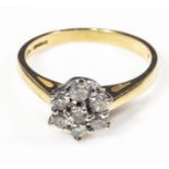 An 18ct gold 7 stone diamond cluster ring, size O