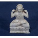 A small ivory figure of a Buddha