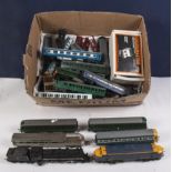 A collection of model train engines and rolling stock