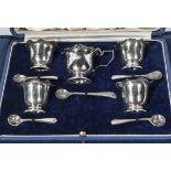 A cased set of silver salts and associated spoons