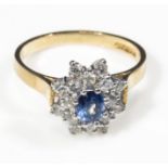 An 18ct gold sapphire and diamond cluster ring 50 point, size P