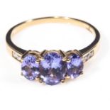 A lady's 18ct gold ring set with tanzanite and diamonds, size T