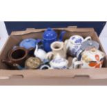 A box of assorted pottery teapots