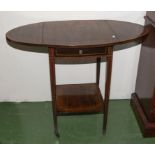 An Edwardian inlaid mahogany drop leaf table.