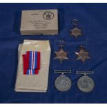 Five WWII medals with ribbons