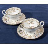 Two Rockingham style cabinet cups and saucers